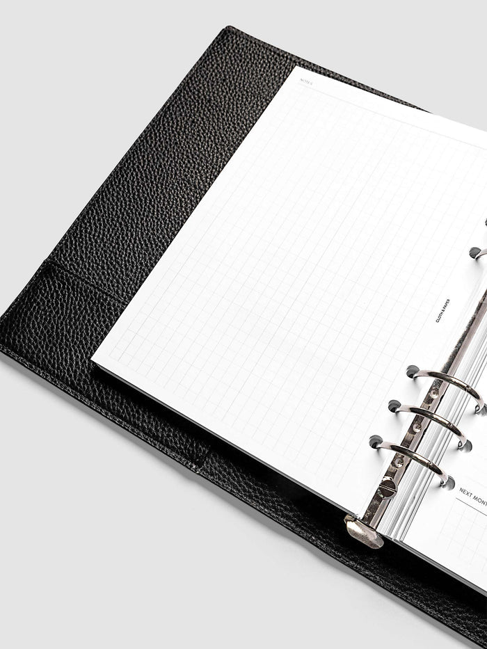 Close-up of the open graph left page in the 2027 Dated Monthly Admin Inserts, A5 6-Ring Punch 6-ring size, showing the grid layout ready for notes, journaling, or freeform planning.