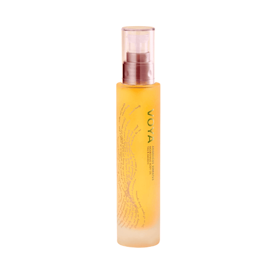 Bottle of Angelicis Serratus Nourishing Body Oil | VOYA with golden liquid and pump dispenser, designed for skincare and body care wellness.