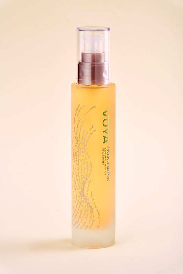 A frosted glass bottle of Angelicis Serratus Nourishing Body Oil | VOYA with a clear pump dispenser, designed for skincare and body care wellness.
