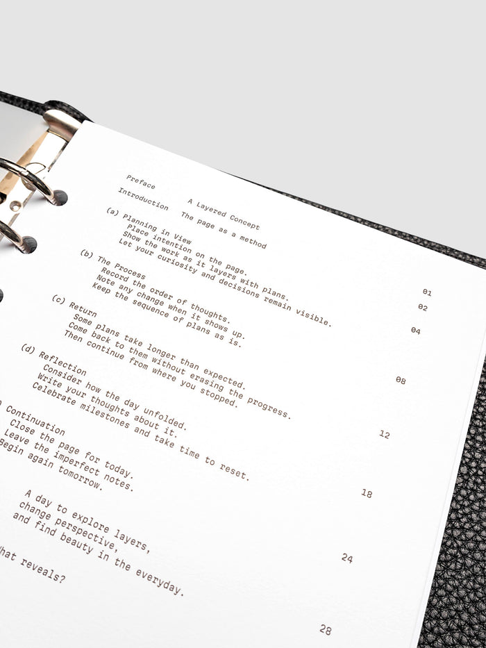 Continuation Planner Cover + Dashboard Set in A5 6-Ring Punch. Milky white frosted plastic cover with a spot gloss organic shape over a black-printed paper dashboard. Image 5 of 5.