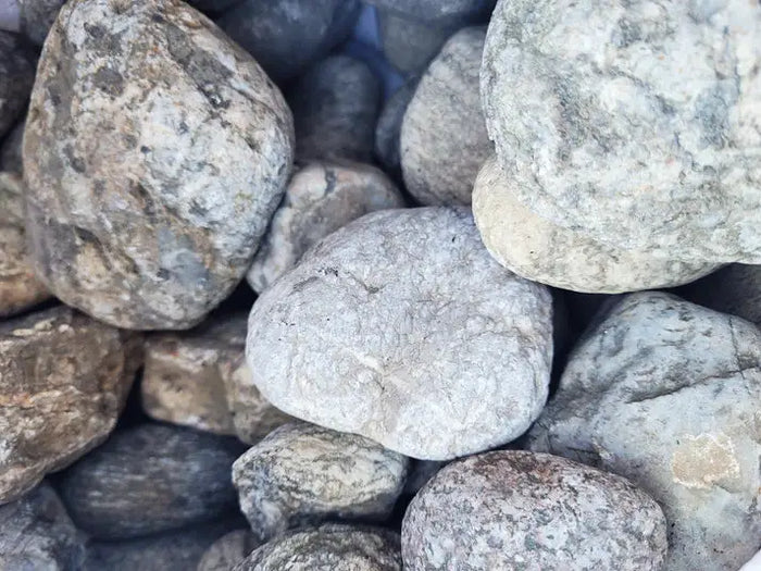 Elderly Boulder: rounded gray river stones with mottled textures