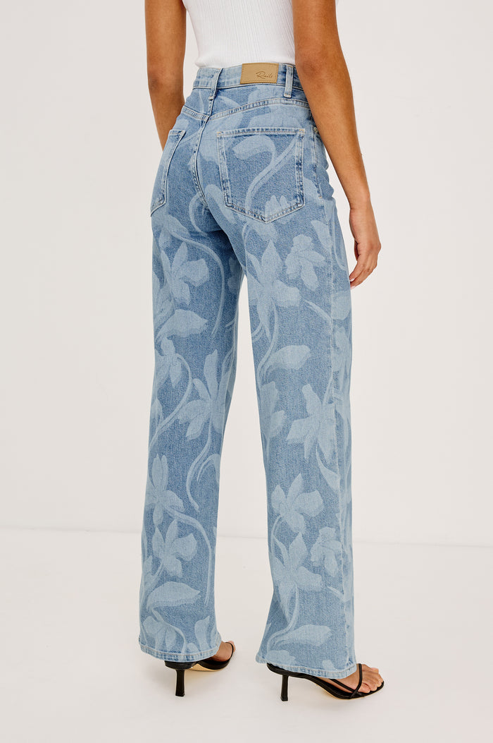 Getty Wide Leg Jean in Light Stretch Denim With High-Rise High-Waisted Fit, Button Fly, and 5-Pocket Styling in Floral Laser Colorway - Lower Body FrBacknt View Featured on Model