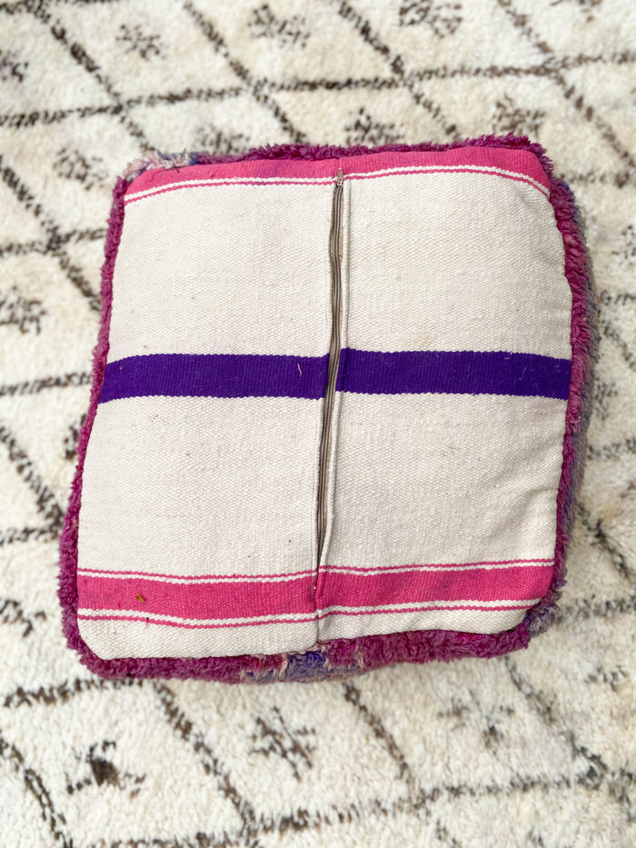 Moroccan pouf vi made using a vintage beni mguild rug