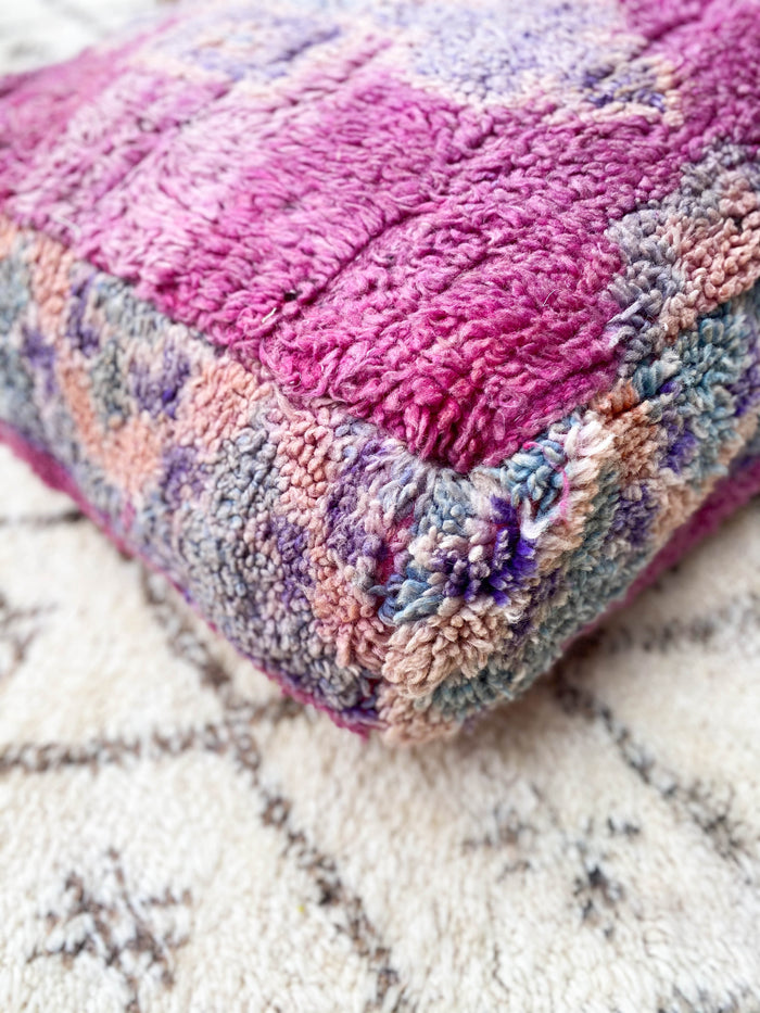 Moroccan pouf vi made using a vintage beni mguild rug